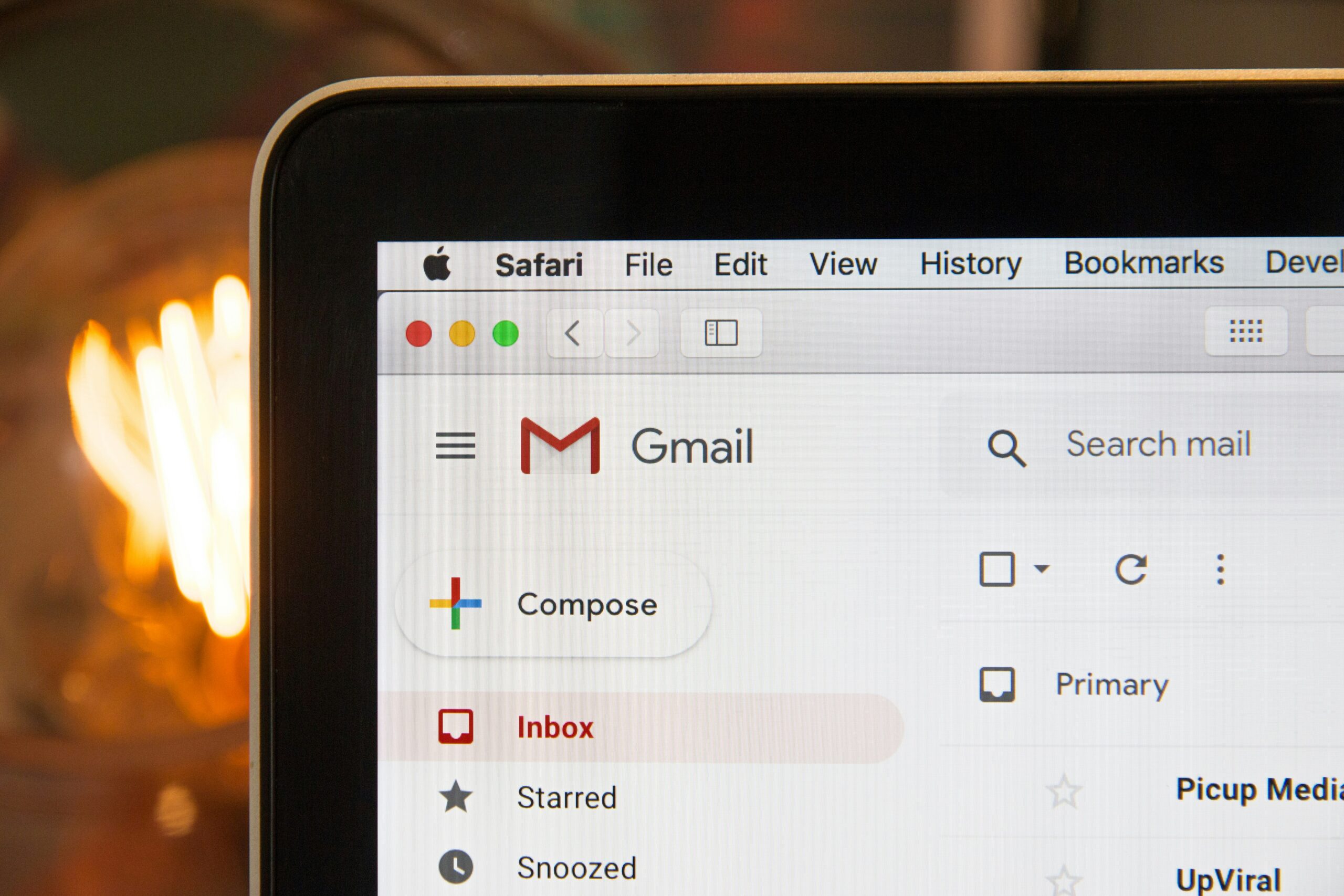 Close-up of Gmail inbox on laptop screen.